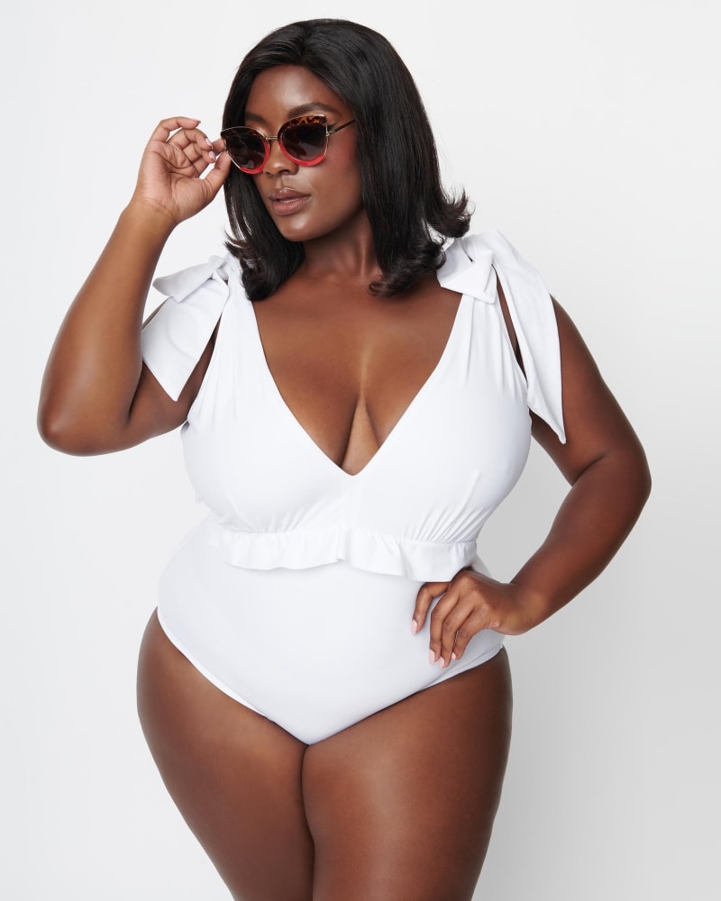 Front of a model wearing a size XL Unique Vintage White Plunge One Piece Swimsuit in White by Unique Vintage. | dia_product_style_image_id:288562